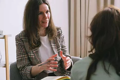 A woman consulting with a psychiatrist